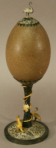A LATE 19TH CENTURY WHITE METAL MOUNTED EMU EGG, Australian, with Emu form knop and serrated