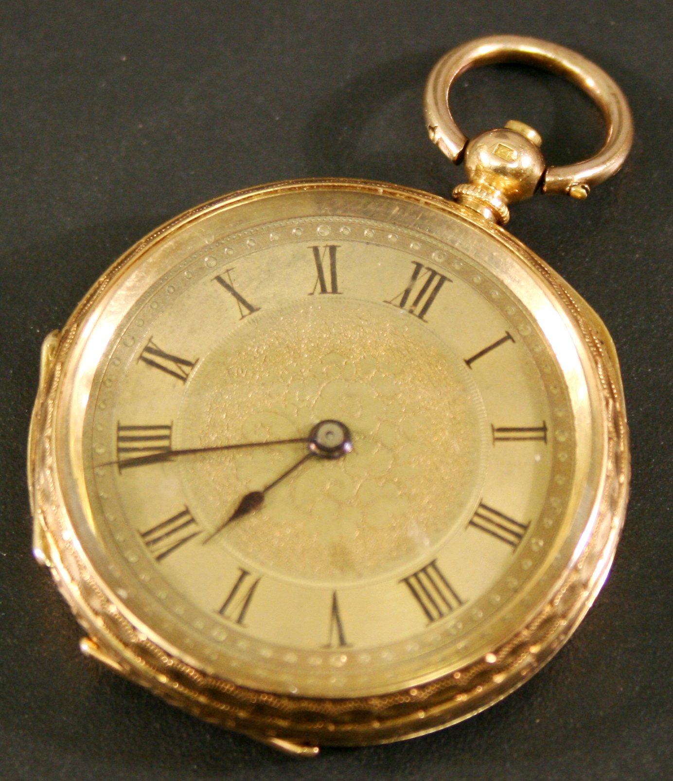 AN 18K GOLD CASED FOB WATCH, the gilt dial with Roman hours framing foliate decoration, the case