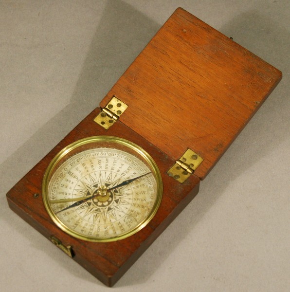 A 19TH CENTURY MAHOGANY CASED POCKET COMPASS with circular printed paper dial  under glass, in a