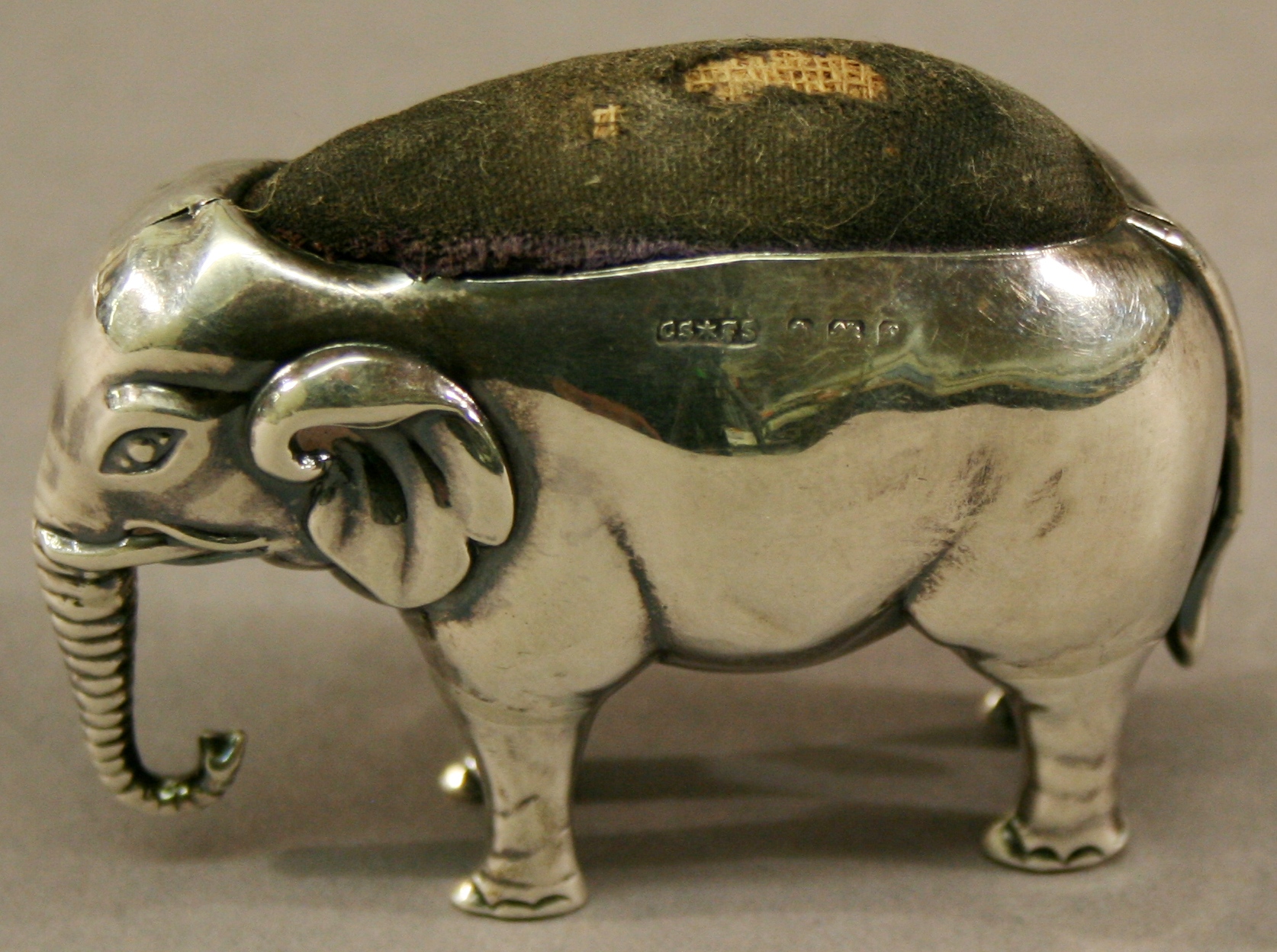 AN EDWARDIAN SILVER PIN CUSHION in the form of an elephant, marks for Birmingham 1905, maker