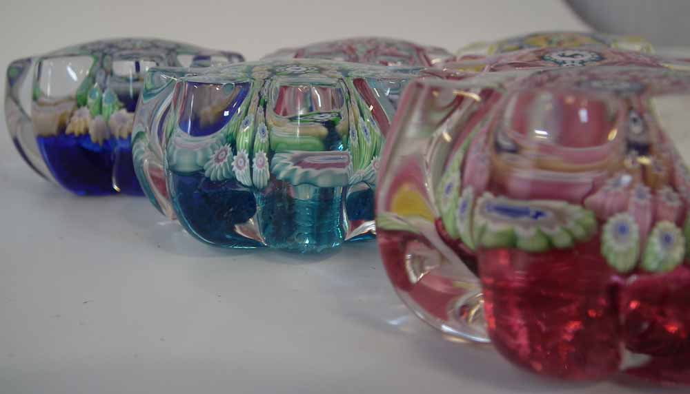 Six John Deacons Millefiori paperweights, with cog shape bodies, set with thistle, stag, dog and - Image 9 of 10