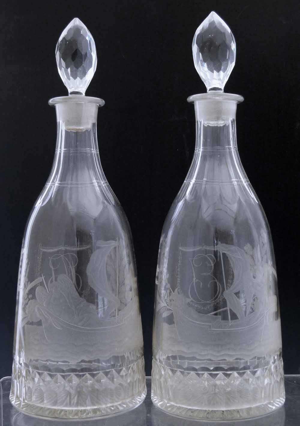 Pair of mallet shaped decanters, early 19th century, engraved with classical  allegorical scenes