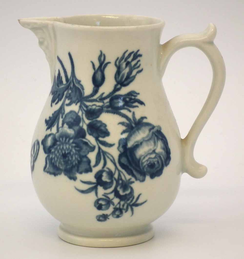 Worcester mask jug circa 1770   printed with natural sprays in underglaze blue, crescent mark to