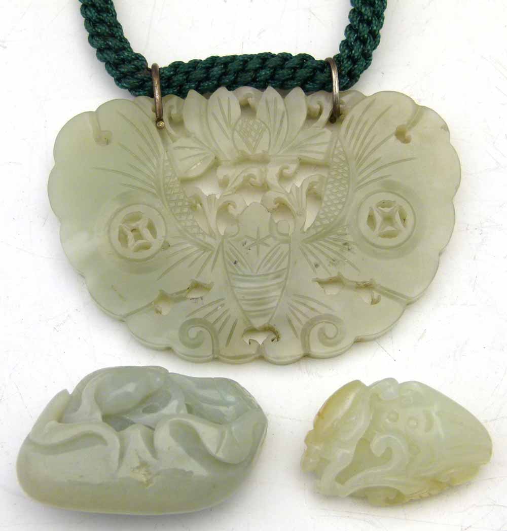 Carved jade butterfly pendant, diameter 8cm, on a braided rope; also a carved jade fish and a beetle