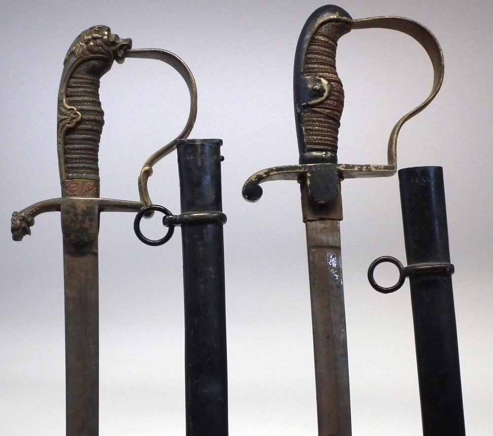 Two Imperial German Infantry Officers swords,   with wire bound grips, one with lion head pommel,
