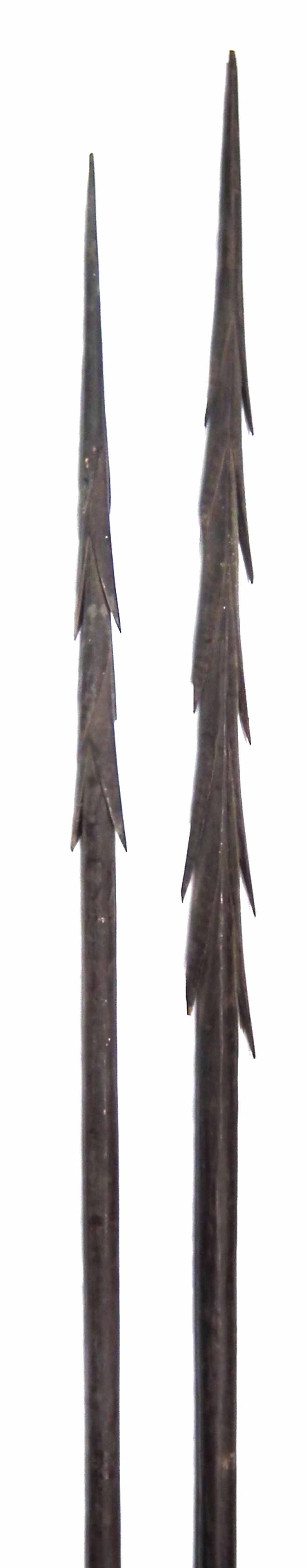 Two Oceanic Polynesian fishing spears, possibly Fijian,   with barbed heads and plain shafts, the