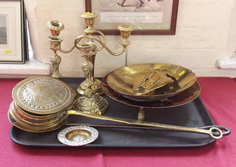 Brass chestnut roaster; skimmer; wall pocket; pair of candlesticks and a candelabra. Condition