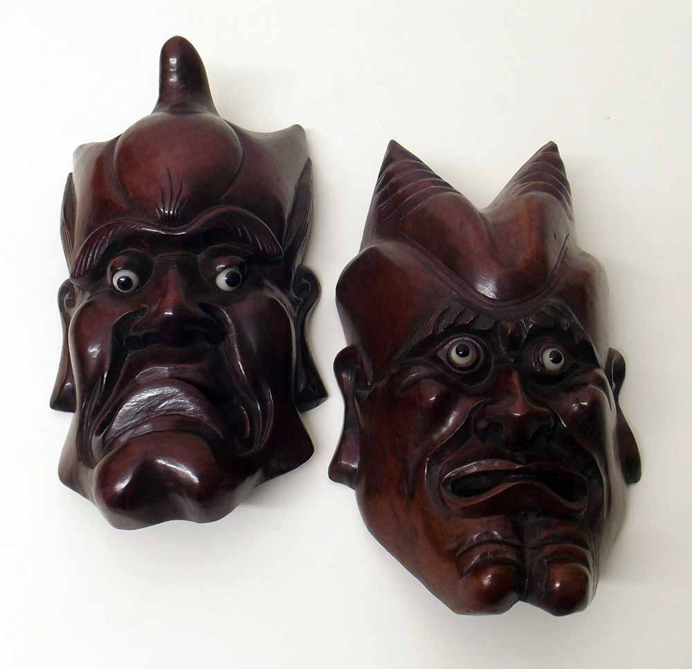 Pair of oriental hardwood Demon masks. Condition report: see terms and conditions