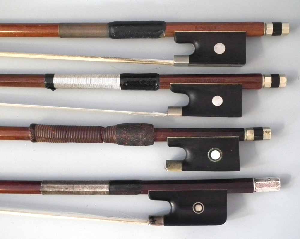 Four violin bows   bearing the stamps Sartory, Kreutzer, and Voirin, (all 4/4) and Paesold (3/4) (4)