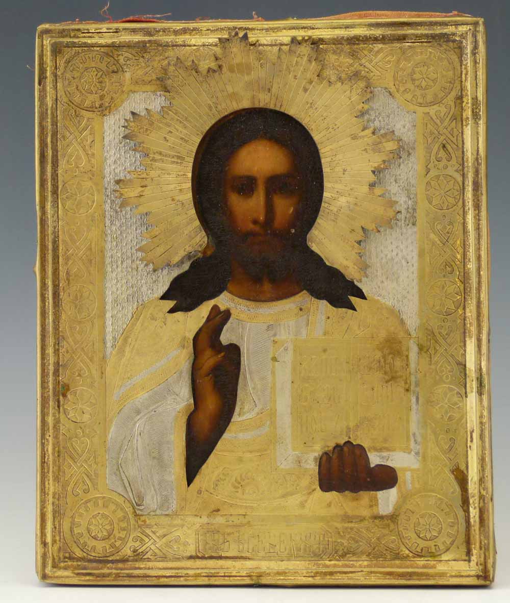 Russian icon of Jesus holding the book in His left hand, the tooled  silvered and gilt oklad cut