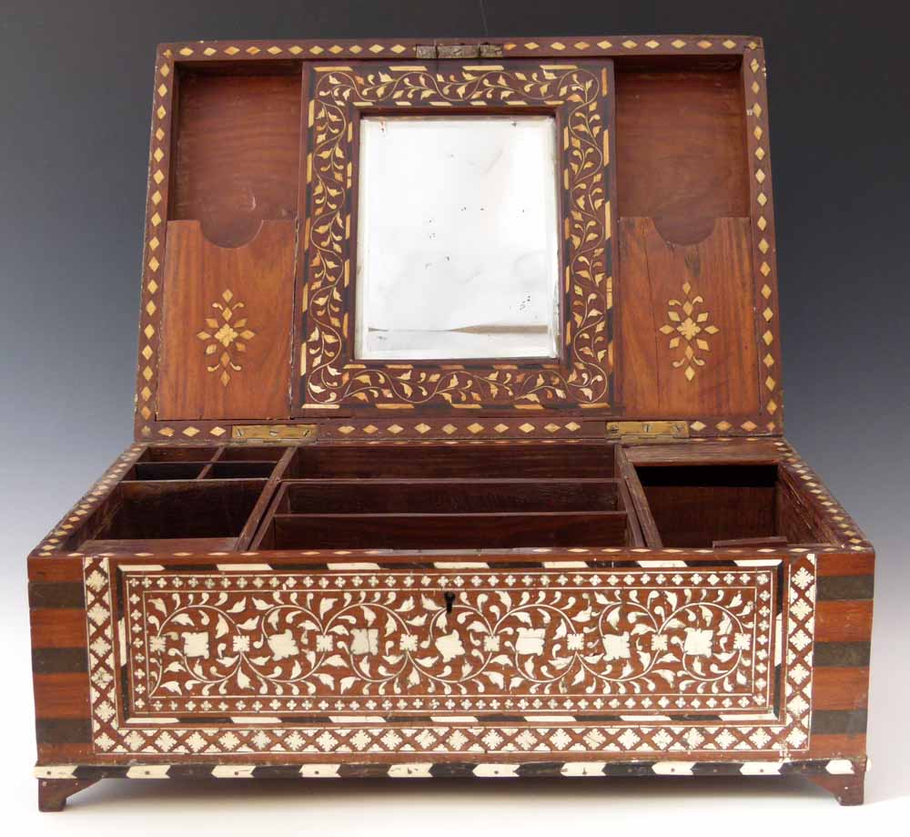 Anglo Indian teak toiletry box profusely inlaid with scrolling ivory foliage, mid-19th century,