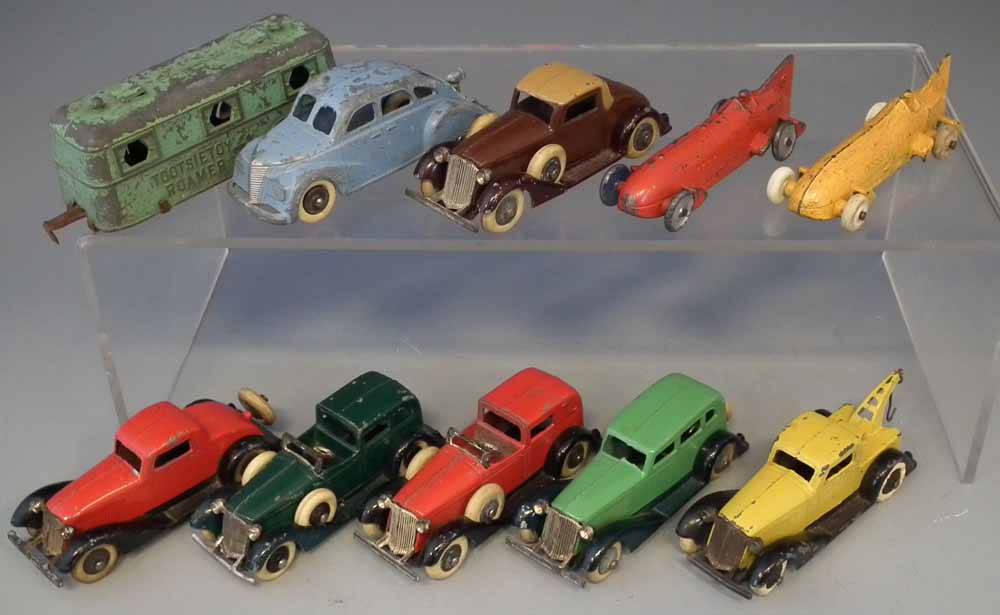 Ten early Tootsie Toy die cast toy vehicles.  (10) Condition Report:  Playwear and paint chipping to