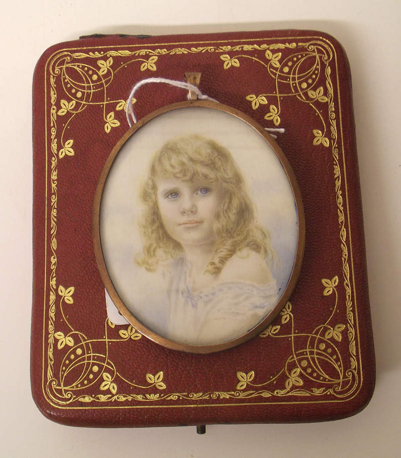 Hand painted portrait on ivoreen mounted in gold plated frame and a red leather case. Condition
