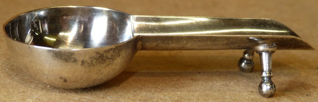 A Birmingham Silver Cigar Ashtray on turned feet