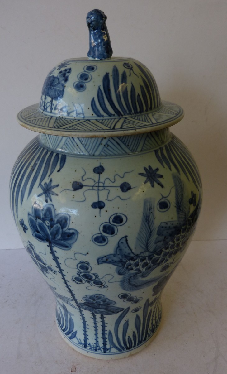 A Large Chinese Round Thin Necked Lidded Ginger Jar on blue and white ground having all over fish,