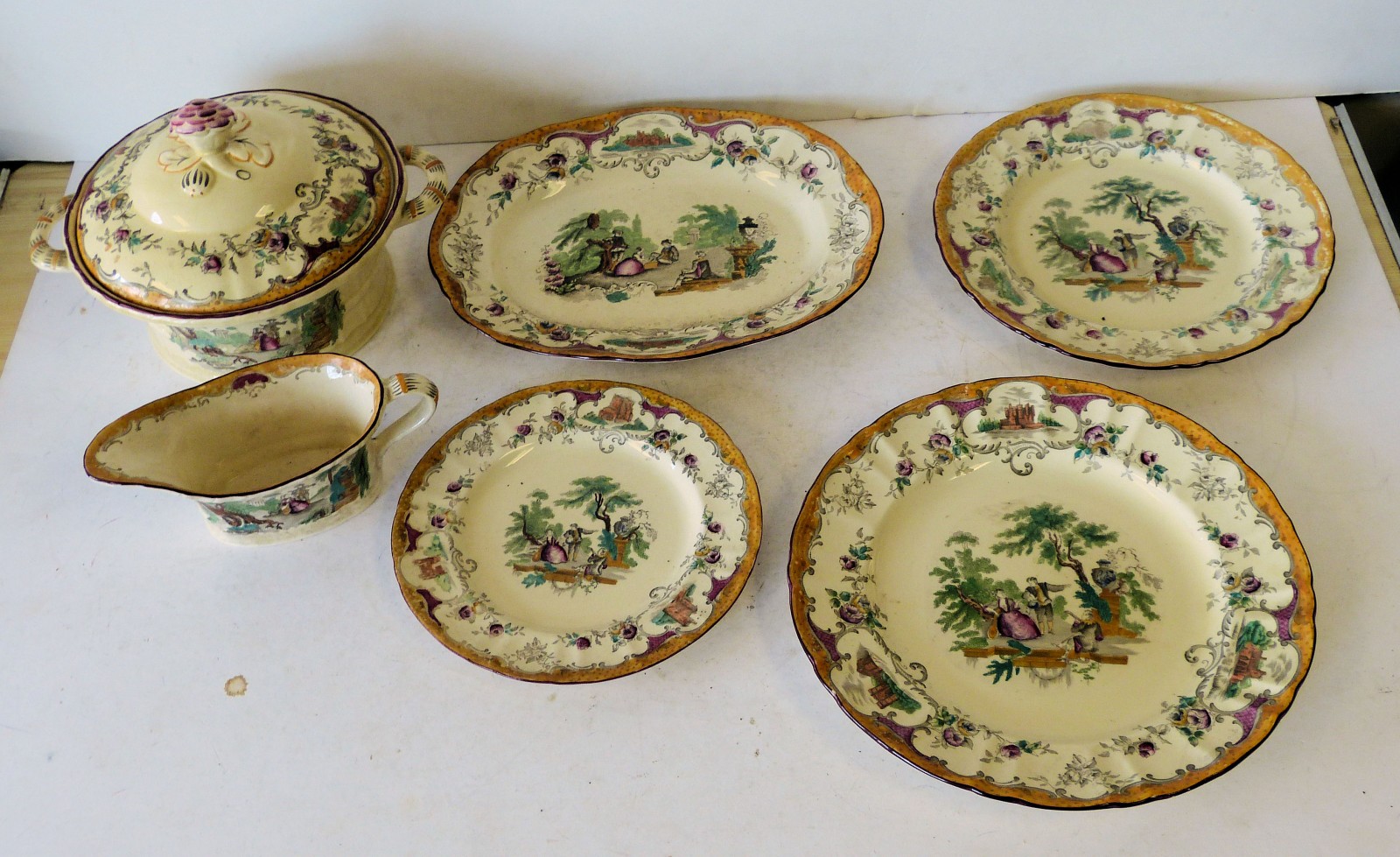 A Leeds China Dinner Service having multicoloured figure, garden, floral leaf and scroll