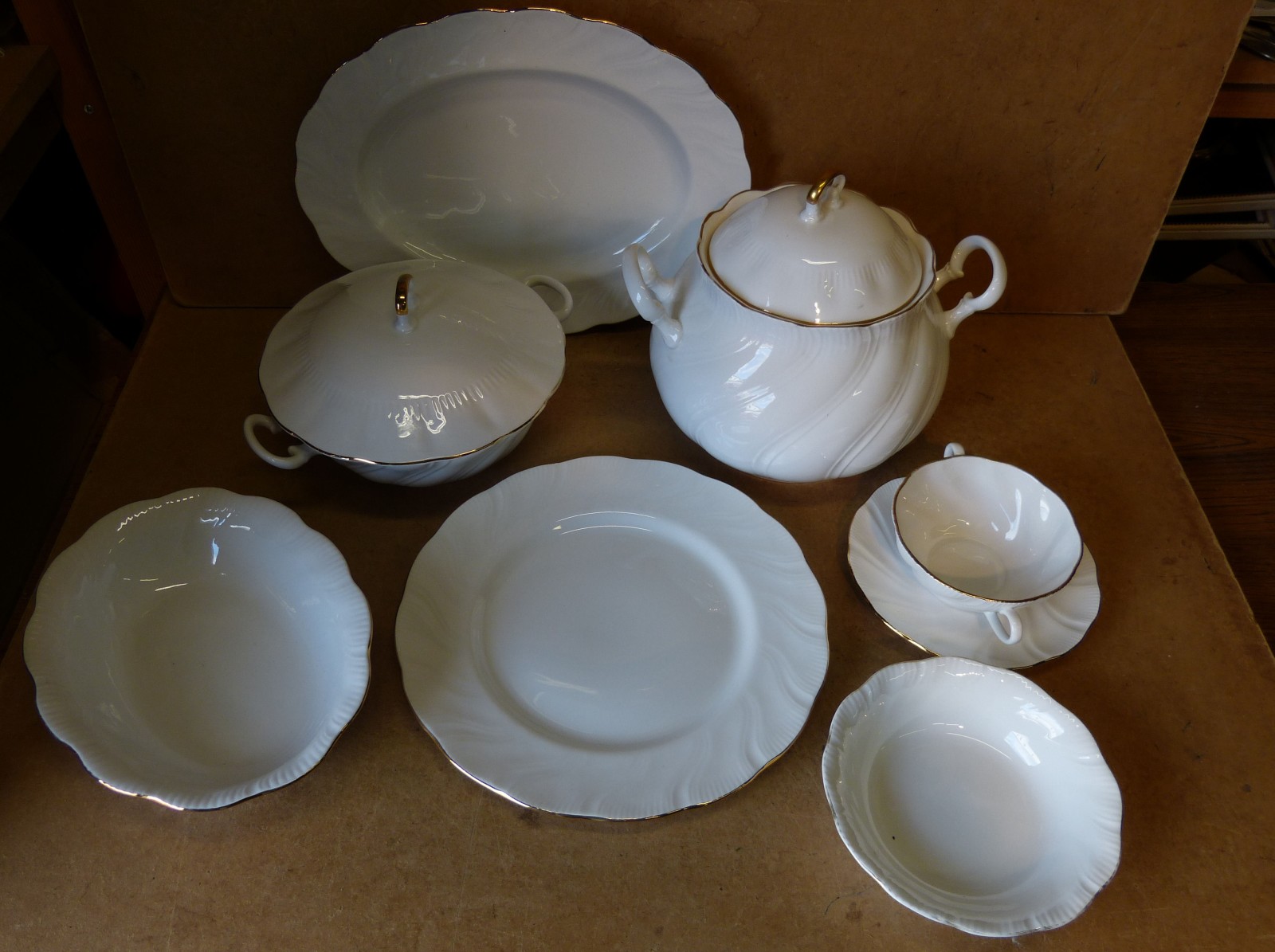 A Queens Bone China "" Marie"" Service on white and gilt ground, comprising 2 meat plates, 3