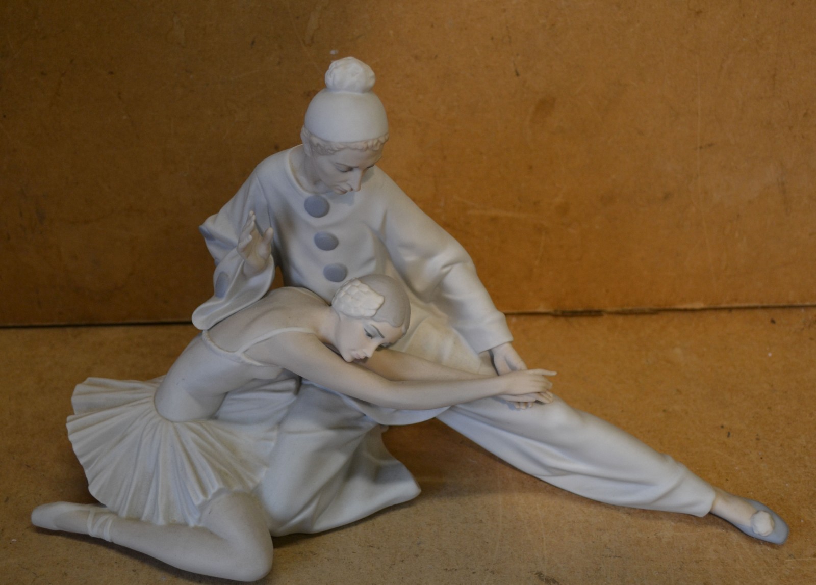 A Lladro Group of a Seated Pirouette and Ballerina, 38cm long x 24cm high