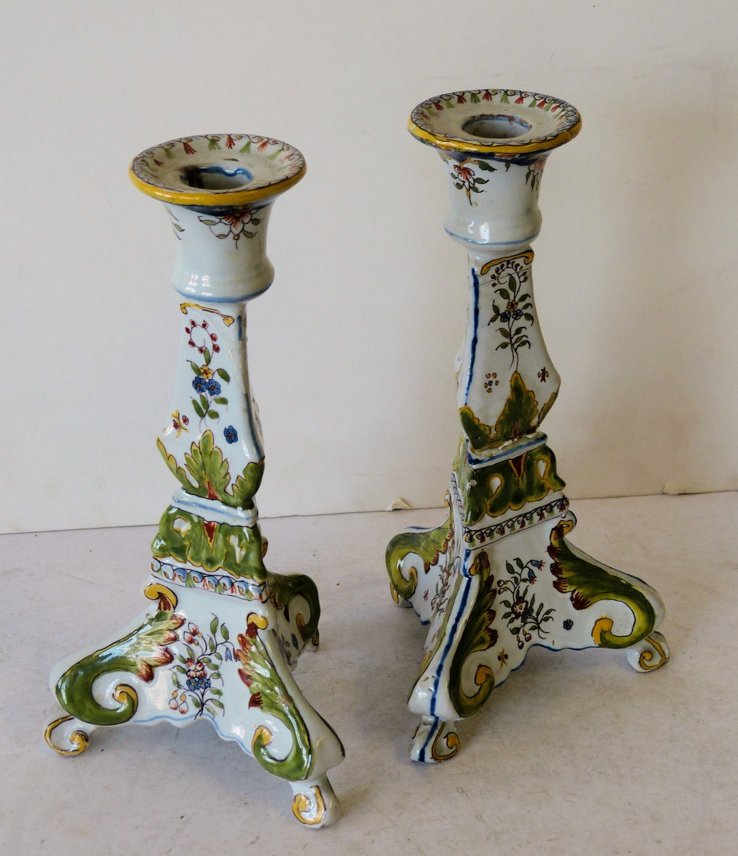 A Pair of Delft Triangular Bulbous Shaped Candlesticks on white and green ground with multicoloured