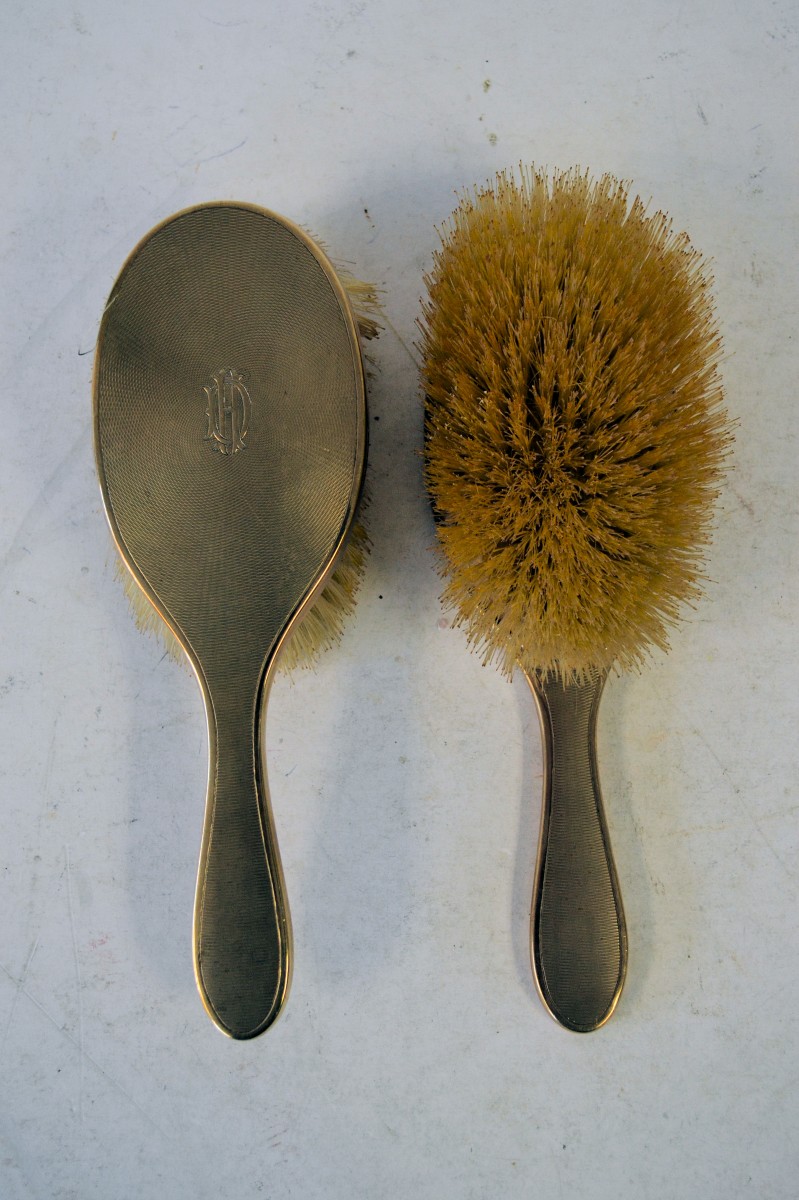 A Pair of 9ct Gold Hair Brushes having all over engine turned decoration weighable gold 118.3gms