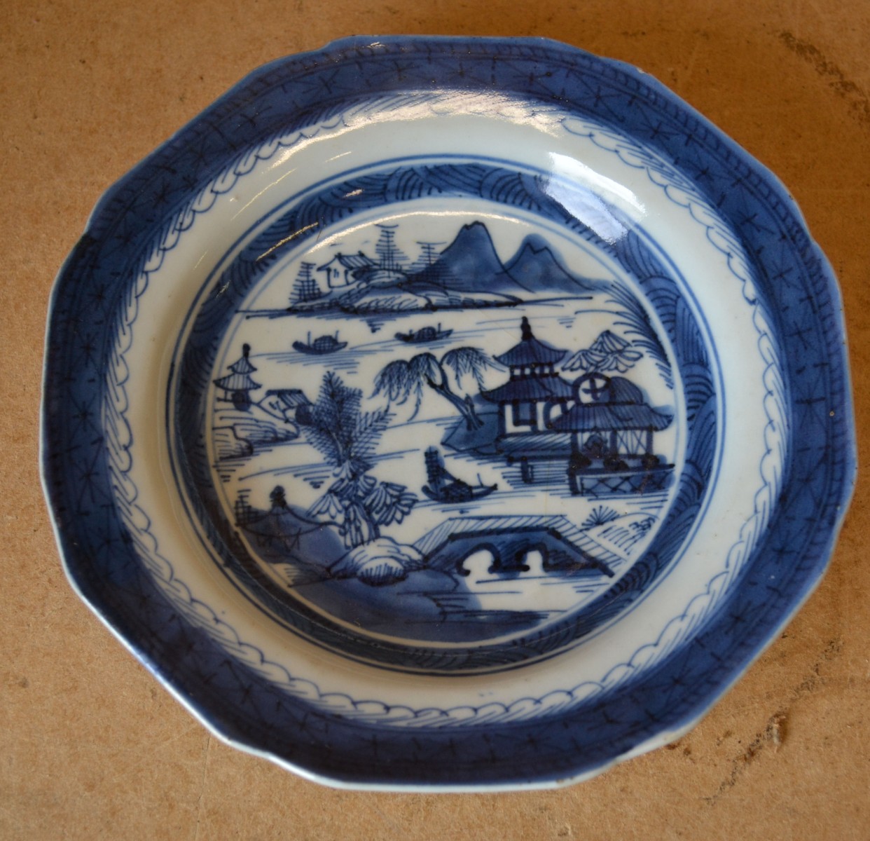 An 18th Century Chinese Octagonal Shape Blue and White Plate having river landscape decoration,