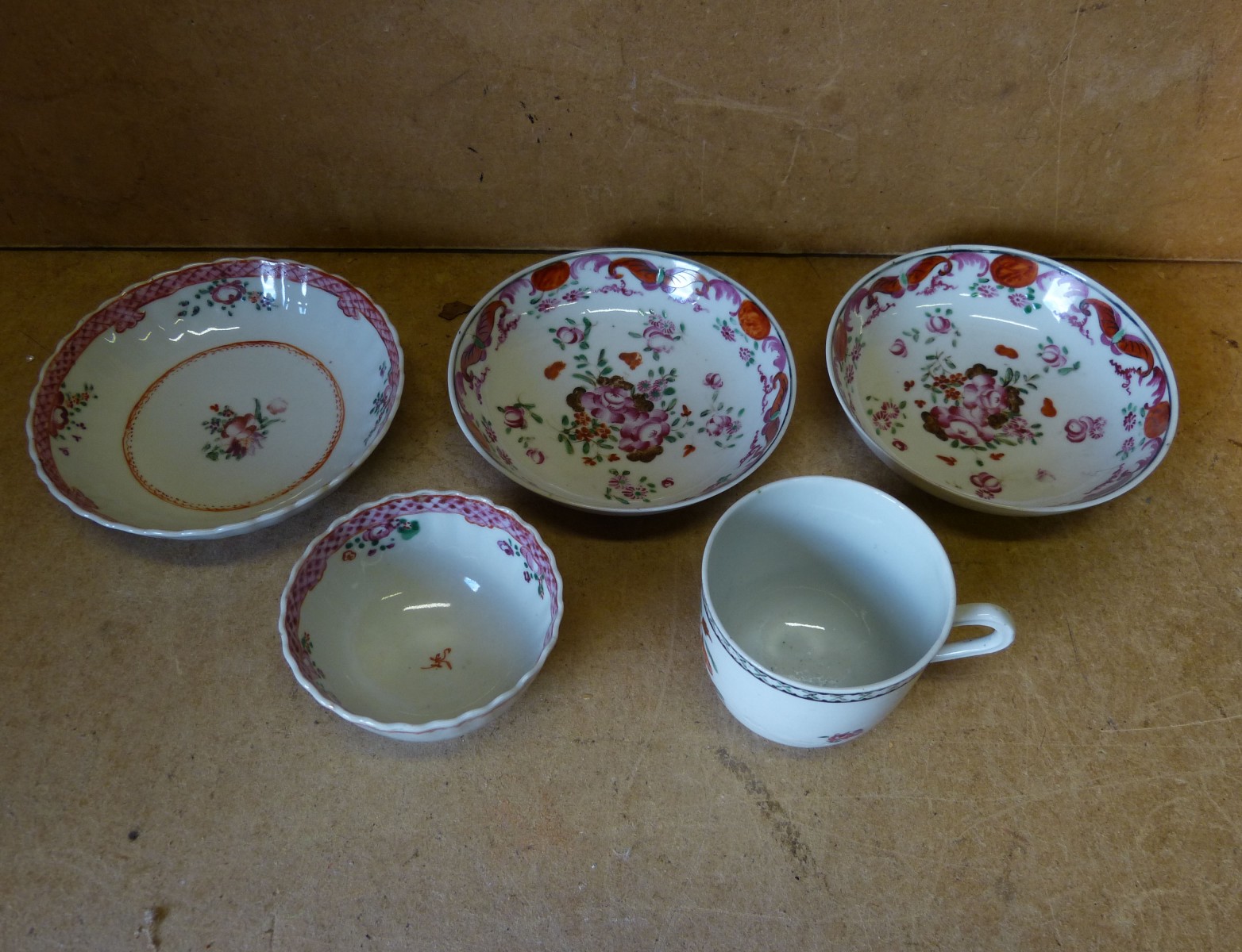 A Pair of 18th Century Chinese Saucers having multicoloured floral and leaf decoration, an oriental