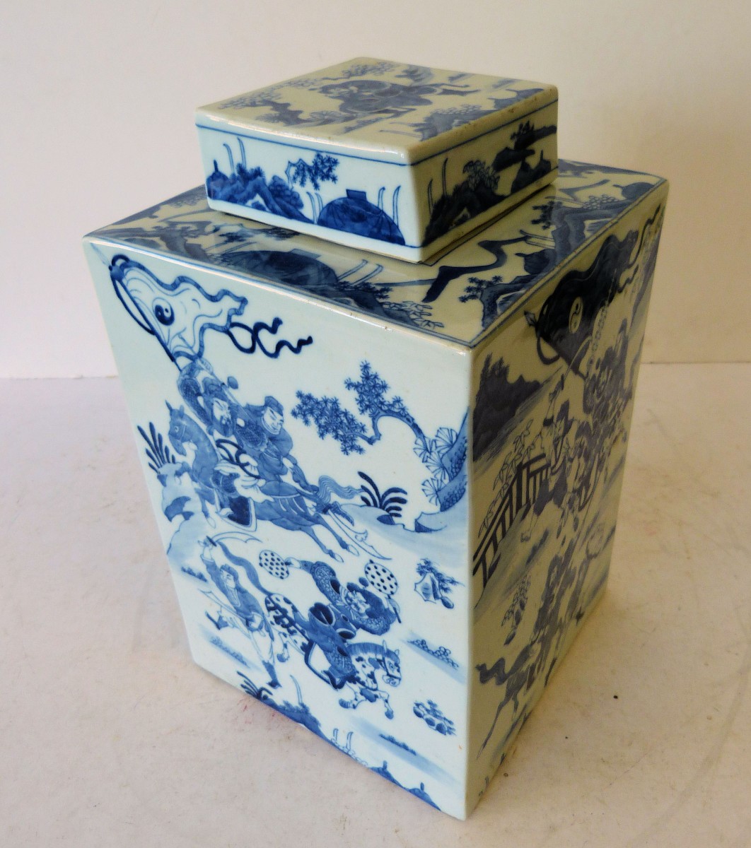 An Oriental Blue and White Square Bulbous Lidded Ginger Jar, having allover warrior landscape