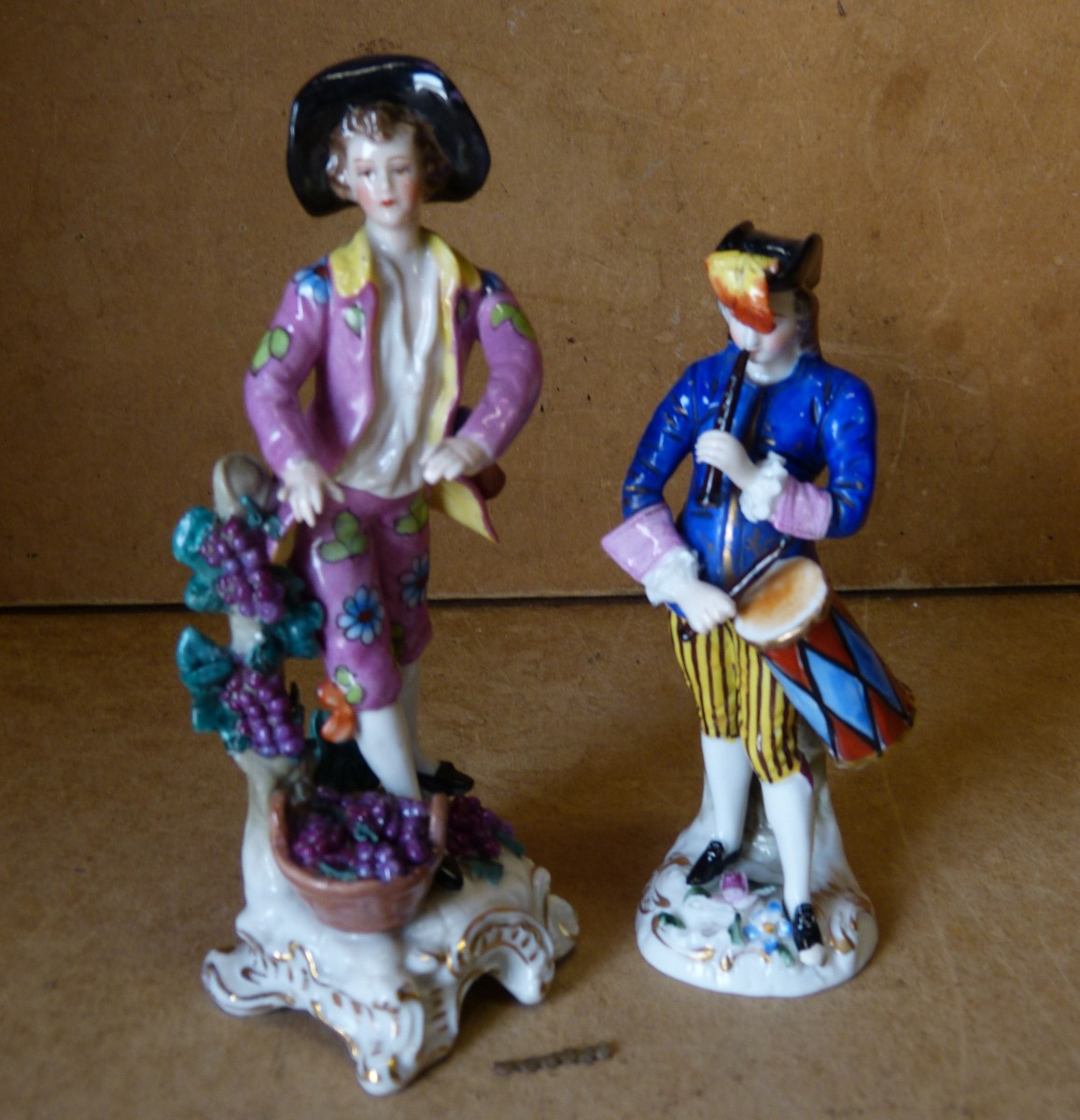 A Hexter China Figure of a young gentleman playing a drum, 13.5cm high also another Hexter china