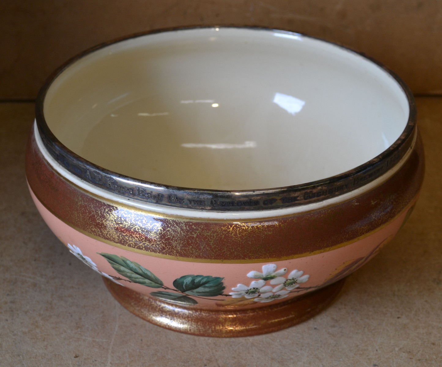 A Victorian China Round Shaped fruit Bowl having plated rim on pink ground with multicoloured