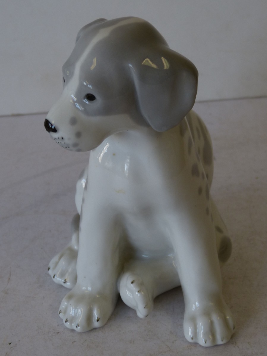 A Larger USSR China Figure of a Seated Puppy on white and grey ground, 17.5cm high