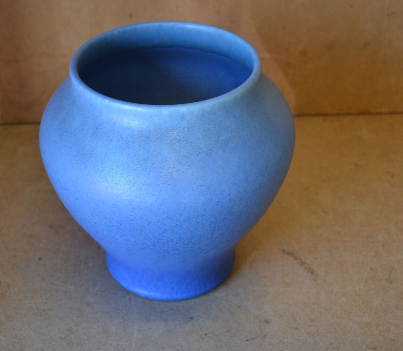 A Royal Lancastrian Bulbous Thin Necked Vase on blue ground, 19cm high