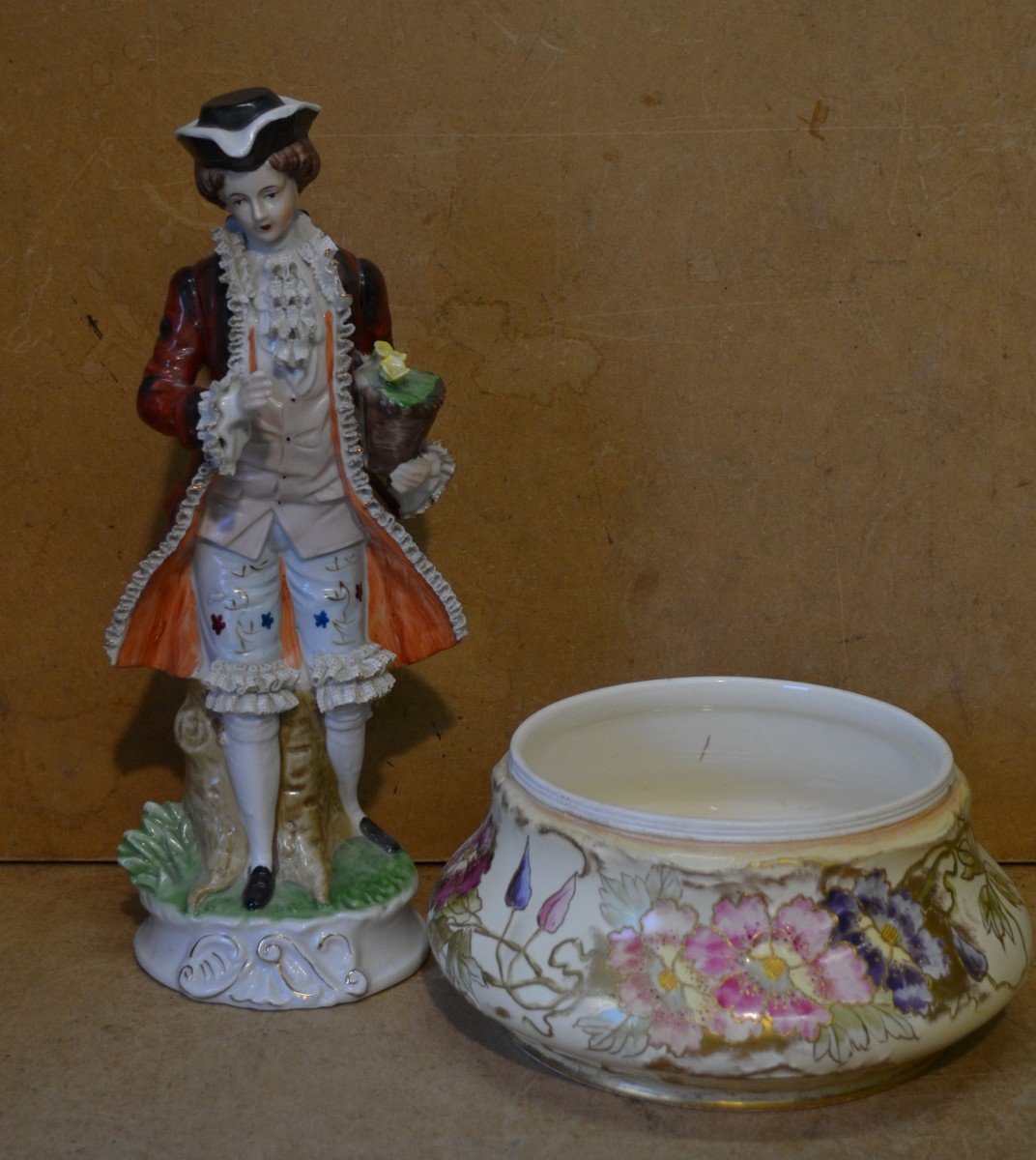 A Bonn China Bulbous Shaped Fruit Bowl, having multicoloured floral, leaf and gilt decoration, 25cm