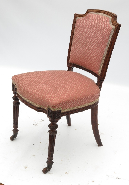 A 19th century oak salon chair, raised on reeded legs