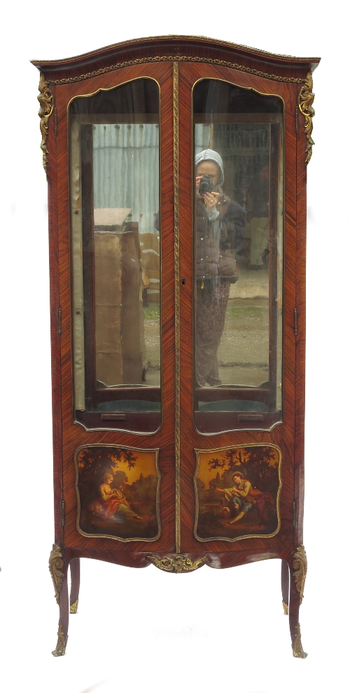 A continental kingwood display cabinet, with mirrored back, glazed side and doors, with painted