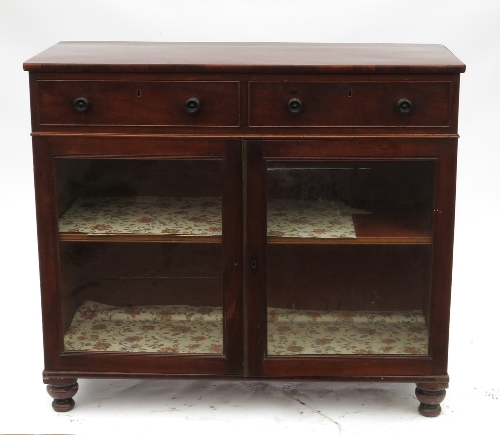 A 19th century mahogany side cabinet, fitted two frieze drawers, with two glazed doors below,