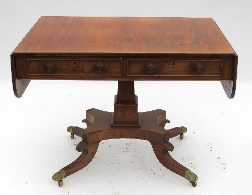 A 19th century mahogany sofa table, fitted two frieze drawers with dummy drawers verso, raised on an