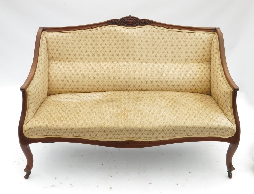 An Edwardian mahogany sofa, with open wood frame, raised on cabriole legs, width 50ins