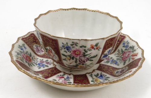 A Worcester Dr Wall concave fluted tea bowl and saucer, later decorated in the 19th century with