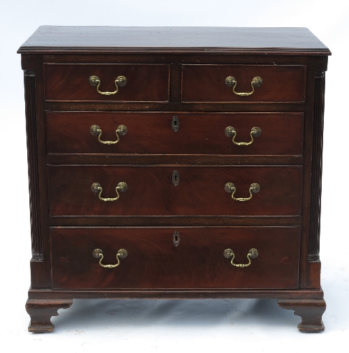 A small Georgian chest of drawers, fitted two short drawers over three long drawers, with quarter