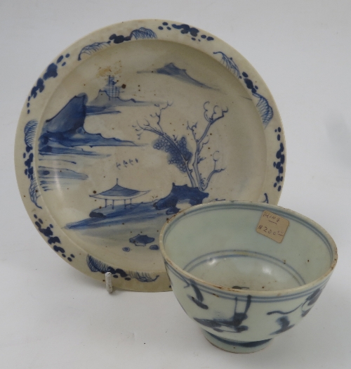 A Chinese tea bowl, decorated in underglaze blue, together with a small dish decorated with a