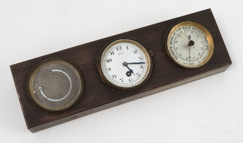 A brass cased desk top weather station, the rectangular case set with a mercury filled