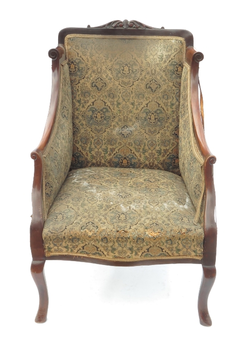 A mahogany showwood frame upholstered armchair, in the Art Nouveau style, raised on short cabriole