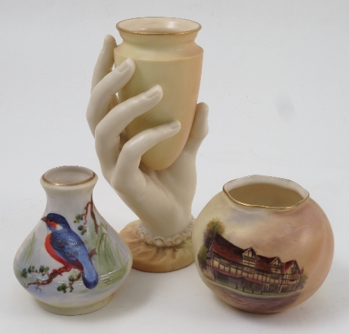 A Royal Worcester blush ivory vase, modelled as a hand holding the vase, height 6ins, together