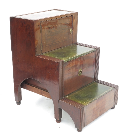 A set of mahogany bedside step commodes, fitted with a drawer and cupboard, with leather inlaid