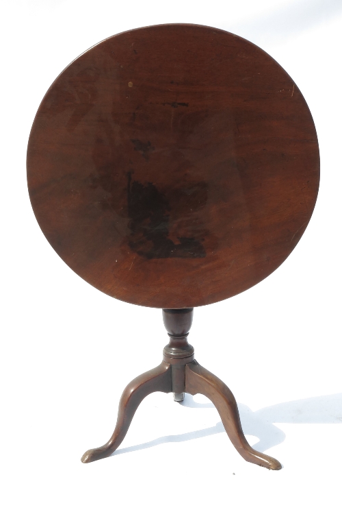 A 19th century mahogany circular occasional table, raised on a turned column terminating in a tripod