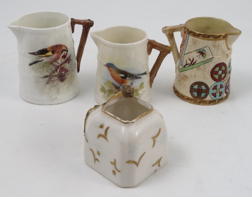 Three Royal Worcester barrel moulded jugs, two decorated with English birds, one signed Roberts, the