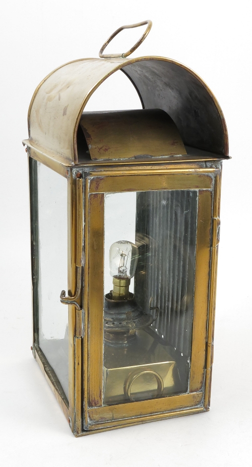 An N.F Ramsay & Co. brass oil lantern, with domed top and three glass sides, height 13ins