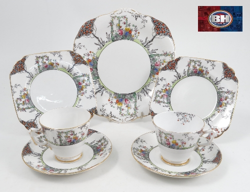 A Grosvenor China part tea service, and sandwich set, printed and enamelled with trees and flowers