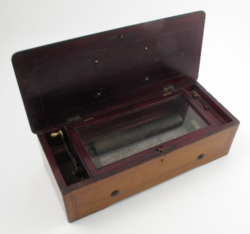 A Nicole Freres musical box, date 1882, box number 46012, housed in a fruitwood case with boxwood