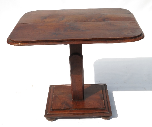 A 19th century oak occasional table, of rectangular form, raised on a triangular column